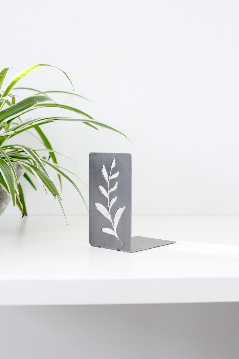 Steel Branch bookend for organizing books. Branch silhouette cut out from metal rectangle