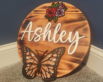 Nursery Name Sign – Scorched Maple Round, 3D Flowers, Butterfly Accents, Acrylic Lettering