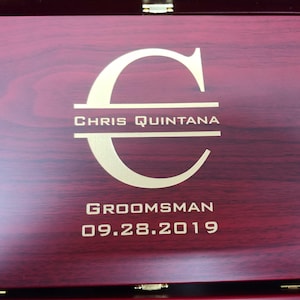 "Personalized rosewood finish martini gift box featuring a custom gold-filled engraving with initial, full name, groomsman title, and wedding date. Elegant and sophisticated design makes it a perfect groomsmen gift or wedding party favor. The rich wood grain and bold customization create a keepsake box ideal for storing bar tools or mementos. Great for weddings, bachelor parties, or personalized gifting occasions.