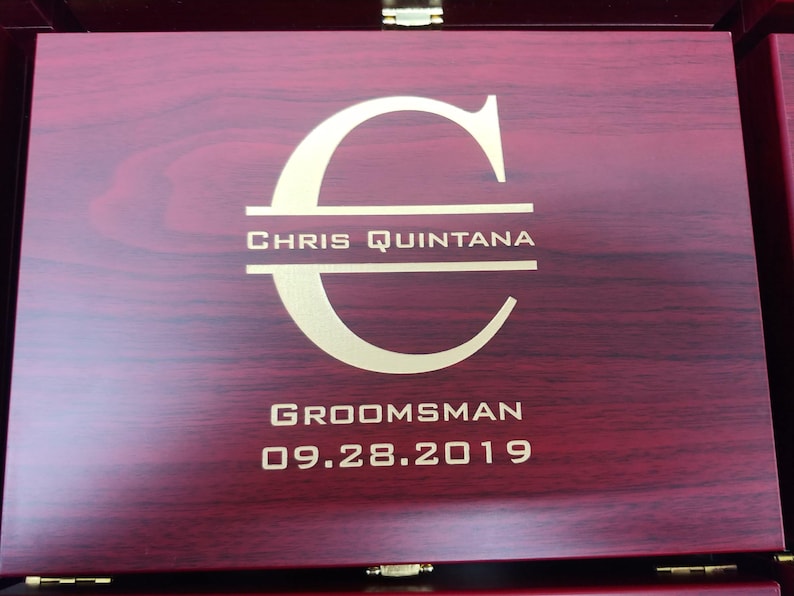 "Personalized rosewood finish martini gift box featuring a custom gold-filled engraving with initial, full name, groomsman title, and wedding date. Elegant and sophisticated design makes it a perfect groomsmen gift or wedding party favor. The rich wood grain and bold customization create a keepsake box ideal for storing bar tools or mementos. Great for weddings, bachelor parties, or personalized gifting occasions.