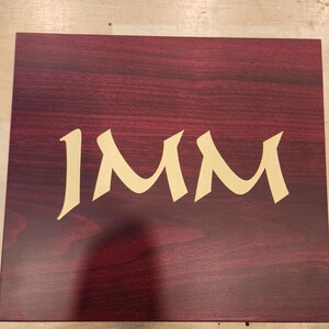 Engraved personalized groomsman gift box made of polished rosewood with custom gold monogram, featuring the name 'Joe Amador', the title 'Groomsman', and wedding date '09.28.2019'. Elegant keepsake box ideal for wedding party gifts, bachelor party favors, or groomsmen proposal sets. The monogrammed initial 'J' adds a classic, tailored touch. Perfect for commemorating a special wedding celebration with custom engraving.
