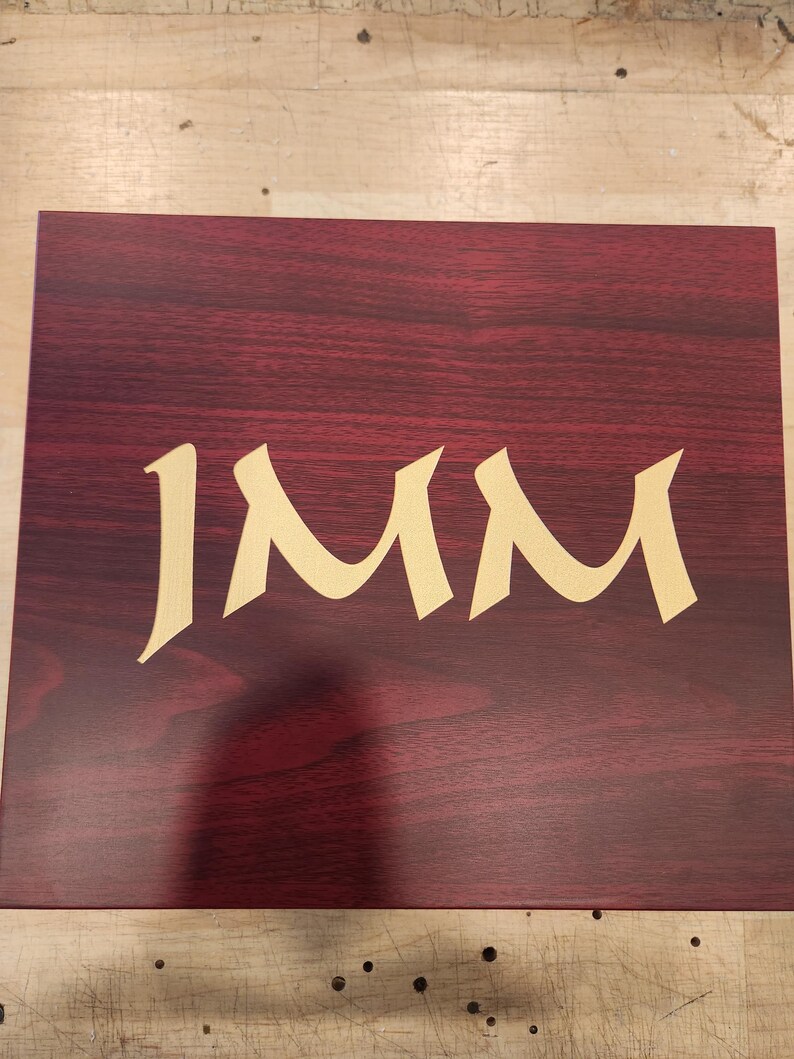 Engraved personalized groomsman gift box made of polished rosewood with custom gold monogram, featuring the name 'Joe Amador', the title 'Groomsman', and wedding date '09.28.2019'. Elegant keepsake box ideal for wedding party gifts, bachelor party favors, or groomsmen proposal sets. The monogrammed initial 'J' adds a classic, tailored touch. Perfect for commemorating a special wedding celebration with custom engraving.