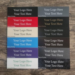 May include: A collection of twelve rectangular signs in various colors including black, red, cream, blue, purple, light green, grey, and dark textures. Each sign features the white or gold printed text Your Logo Here and Your Text Here.