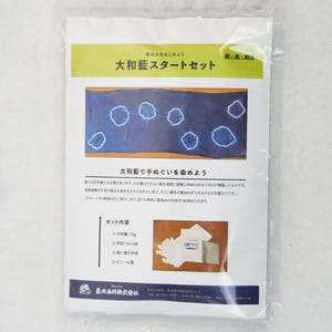 May include: A blue and white package with the text "大和藍スタートセット" (pronounced "Daiwa Ai Start Set") and "髪染めをはじめよう" (pronounced "Kami Some Hajimeyou") which translates to "Let's start dyeing hair". The package contains a kit for dyeing fabric with indigo dye.