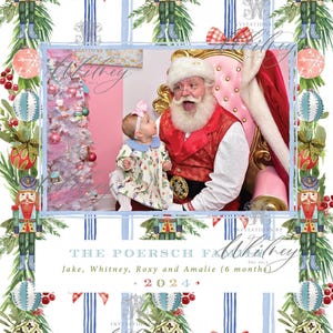 May include: Christmas-themed family photo invitation. The design features a photo of Santa Claus with a baby, surrounded by watercolor illustrations of nutcrackers, ornaments, and greenery. Text includes family name and year.