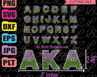 Könnte beinhalten: Ein Strass-Design für die Buchstaben AKA in Pink und Grün. Das Design ist 8 Zoll breit und 2,46 Zoll hoch. Die Buchstaben sind mit SS10 Strasssteinen besetzt.