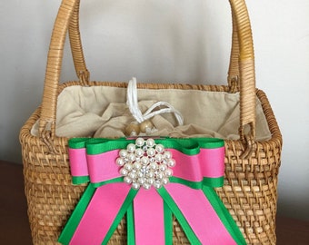 Rattan Two Handle Purse with Pink and Green Ribbon and attached Pearl Rhinestone Brooch