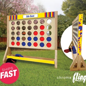 May include: A large wooden Connect Four game with red, blue, and white circular game pieces. The game board has a yellow top and base with red, blue, and yellow stripes. The text "Kiddie Connect" is on the top.
