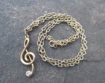 Treble clef necklace