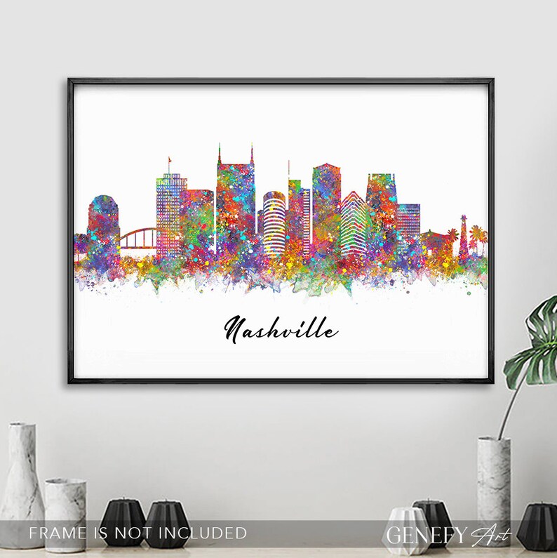 May include: A colorful watercolor painting of the Nashville skyline. The city's iconic buildings are depicted in a variety of shades of blue, green, yellow, orange, and red. The painting is set against a white background and includes the word "Nashville" in black script.