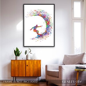 May include: A colourful watercolour painting of a surfer riding a wave. The surfer is silhouetted in black and the wave is a vibrant mix of colours, including blue, green, yellow, orange, red and purple.