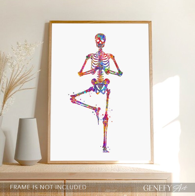 May include: A colorful watercolor painting of a skeleton in a yoga pose. The skeleton is in a tree pose, with one leg raised and the other leg bent. The skeleton is painted in shades of pink, blue, green, yellow, and orange.