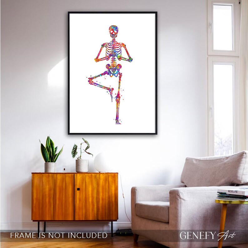May include: A colorful watercolor painting of a skeleton doing a yoga pose. The skeleton is in a tree pose with its arms raised above its head. The background is white.