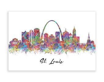 Op de afbeelding: Een aquarel van de skyline van St. Louis, met de iconische Gateway Arch en andere gebouwen. De schildering is gemaakt in een levendige regenboog van kleuren, met spatten verf die een textuur-effect creëren.