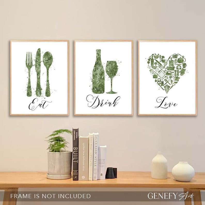 May include: Three green watercolor prints with the words "Eat", "Drink", and "Love" in a cursive font. The "Eat" print features a fork, knife, and spoon. The "Drink" print features a wine bottle and wine glass. The "Love" print features a heart shape made up of kitchen-related icons.