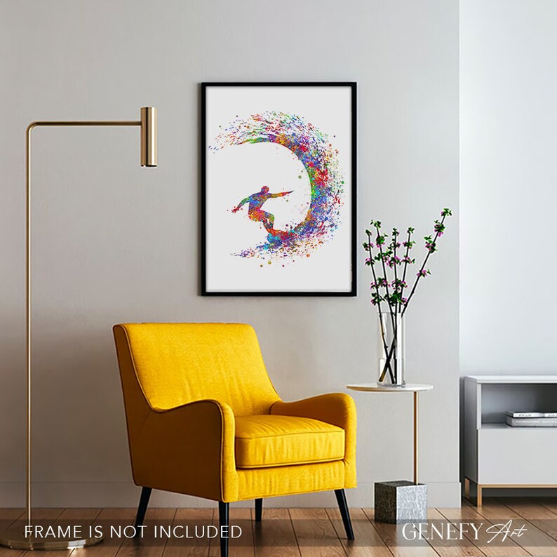 May include: A colourful watercolour painting of a surfer riding a wave. The painting is framed in black and is hanging on a white wall.