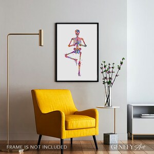 May include: A colorful watercolor painting of a human skeleton in a yoga pose. The skeleton is standing on one leg with the other leg bent at the knee. The arms are raised above the head, and the hands are in a prayer position. The skeleton is painted in shades of pink, blue, green, yellow, and orange.