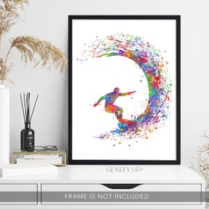 May include: A colourful watercolour painting of a surfer riding a wave. The surfer is silhouetted in black and the wave is a vibrant rainbow of colours. The painting is framed in black and has the text "GeneFy Art" at the bottom.
