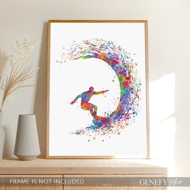 May include: A colourful watercolour painting of a surfer riding a wave. The wave is depicted in a vibrant rainbow of colours, with splashes of paint creating a dynamic and energetic feel. The surfer is silhouetted in black, adding a sense of contrast and movement to the artwork.
