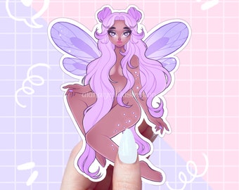 May include: A sticker featuring a purple fairy with wings, long hair, and a sparkly body. The fairy is sitting with her legs crossed and has a sweet expression on her face.