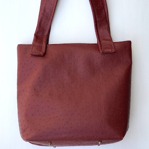 Burgundy ostrich faux leather shoulder bag with spacious interior!