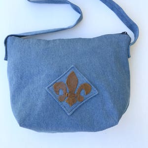 Denim shoulder bag with fleur de lis design in leather--perfect for summertime!