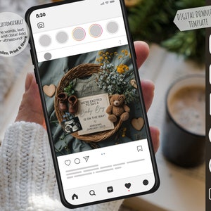 May include: A digital download template for a baby announcement on a smartphone screen. The announcement features a wreath with a teddy bear, baby booties, and a sign that reads "We're excited to say a Baby Boy is on the way! Arriving January 2025."