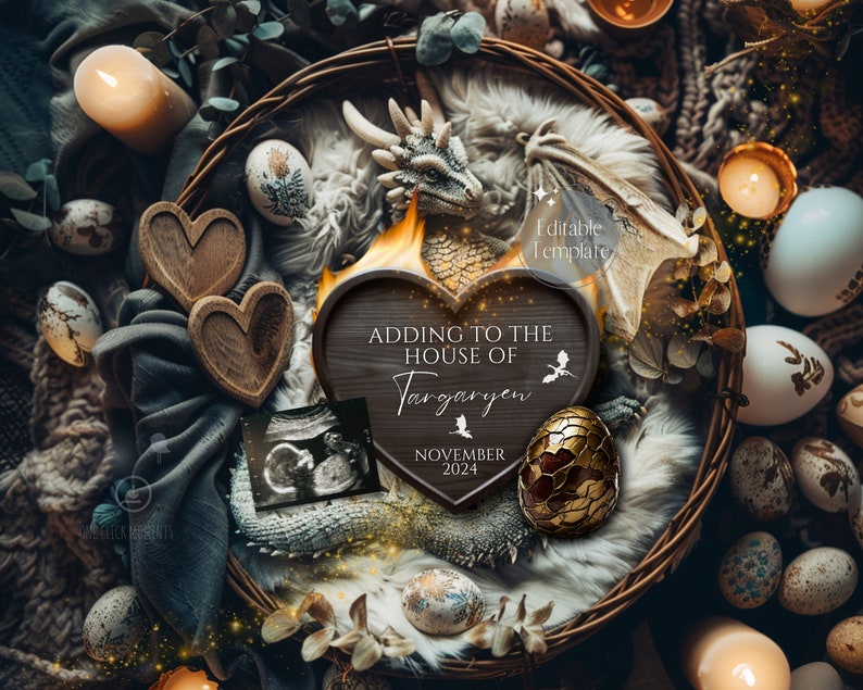 May include: A wooden heart-shaped sign with the text "Adding to the House of Targaryen November 2024" surrounded by a nest of faux dragon eggs, a dragon figurine, and a baby ultrasound image.