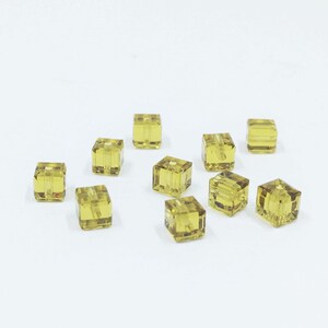4mm Cube Lime SWAROVSKI® Crystal Beads #5601. Packages of 10. Dark Yellow color genuine Austrian crystal.