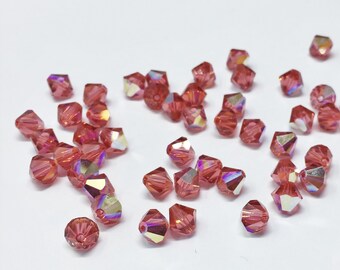 Padparadscha AB 6mm Bicone SWAROVSKI® Crystal Beads #5301 package of 50. Orange Pink with Rainbow Finish Genuine Austrian Crystal #5328