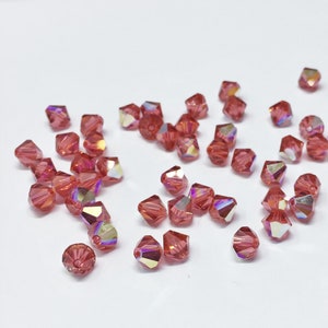Padparadscha AB 6mm Bicone SWAROVSKI® Crystal Beads #5301 package of 50. Orange Pink with Rainbow Finish Genuine Austrian Crystal #5328