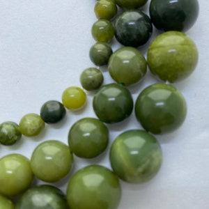 Mixed Greens Canadian Jade Gemstone Beads. 15” strands of soft green Jade beads, available in 4-12mm.