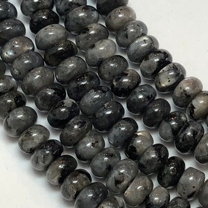 4x6mm Rondelle Black Labradorite (Larvikite) Gemstone Beads. 15&quot; strand of rondelle Black Labradorite beads. Nice neutral with some flash.