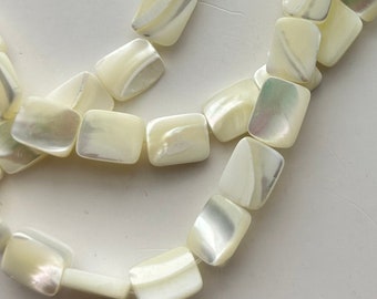 8x10 Mother of Pearl rectangle gemstone beads. 15” strand of white shell rectangles, 39 beads per strand.