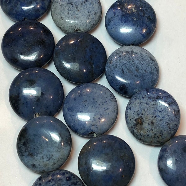 16mm Puff Coin Dumortierite Gemstone Beads. Full 16" strand of light blue Dumortierite, 27 beads per strand. Beads vary slightly in color.