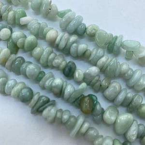 Burma Jade Gemstone Chip Beads. 15” strand of High quality chip beads, about 115 per strand. Pale celery green jade.