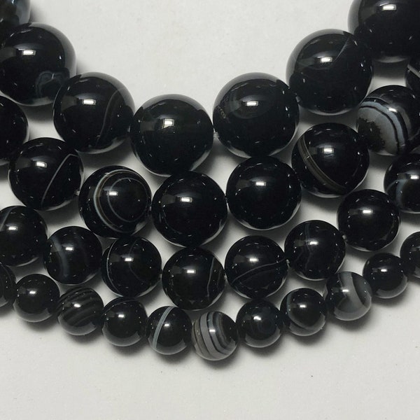 Black & White Sardonyx Gemstone Beads. Full 15" strand of AAA grade beads, 6 -12mm available. Black/white banded microcrystalline quartz.