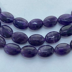 10x14mm Oval Amethyst Gemstone Beads. 15” strand of deep purple oval beads, about 29 per strand.