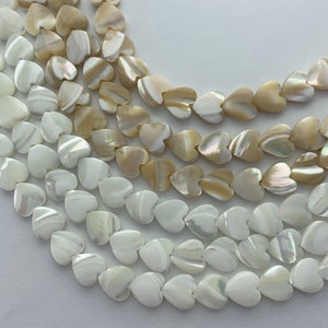 10mm Heart Mother of Pearl gemstone beads. 15” strand of hearts, available in two colors.