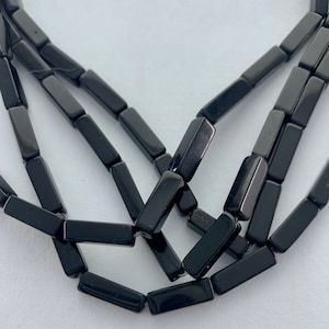 4x13mm rectangle Black Onyx gemstone beads.  15” strand of black rectangle shaped beads, approx. 30 per strands.