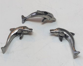34mm long and 19mm wide Package of 2. Pewter Dolphin pendant with antique pewter or gold finish