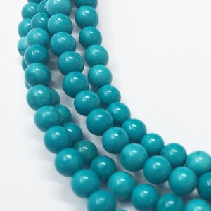 Turquoise Dyed Magnesite Gemstone Beads. 6mm round beads on 15 inch strand. Full strand of beads, about 64 per strand. Imitation Turquoise
