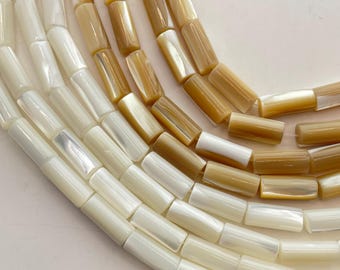 6x14mm Tube Mother of Pearl Gemstone Beads. 15" strand of high quality tube beads, available in white or beige (tan). 28 beads per strand.