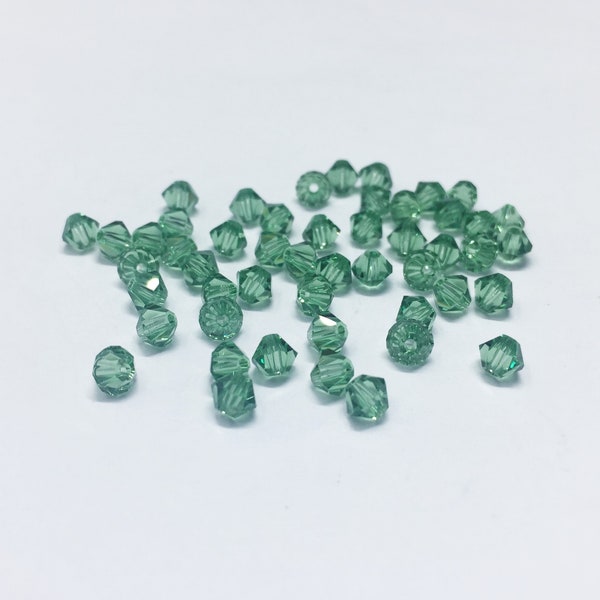 Erinite 4mm Bicone SWAROVSKI® Crystal Beads #5301 package of 50. Sage Green color Genuine Austrian Crystal. Bulk #5328.