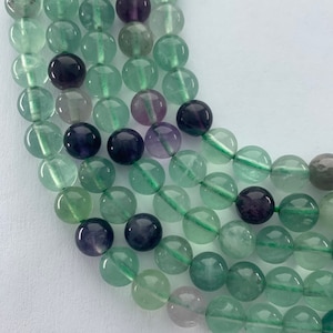8mm Rainbow Fluorite gemstone beads.  15” strand of round beads, approximately 48 per strand.  On sale.  Lot BA