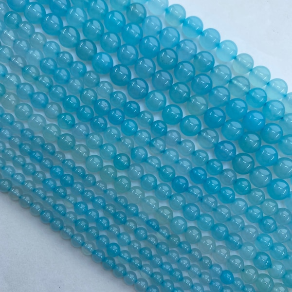 Aqua Blue Chalcedony Gemstone Beads. Full 15" strand of nice quality round beads, 6mm-12mm available. Soft blue translucent stone.