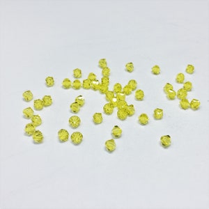 Citrine 4mm Bicone SWAROVSKI® Crystal Beads #5301 package of 50. Bright True Yellow color Genuine Austrian Crystal. Bulk. #5328.