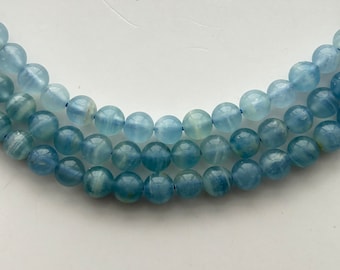 6mm Argentina Aragonite A grade gemstone beads. 15” strand of round beads, 62 per strand.  Promotes tolerance and insight.