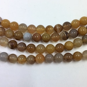 Petrified Wood Beads. 6mm round beads on 15 inch strand. Full strand of AA/AAA Grade beads, roughly 60 beads per strand. Wooden Agate Beads