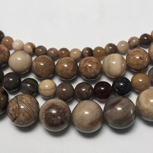 Wooden Agate Gemstone Beads.  15” strand of round high quality beads, avail. 4-10mm. Opaque petrified wood beads.
